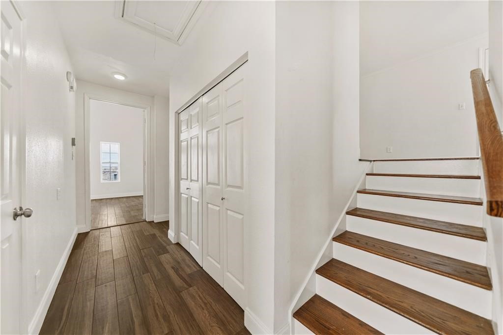 741 Snug Corpus Christi, TX 78402 - Photo 23 of 40 a view of a hallway with wooden floor and staircase