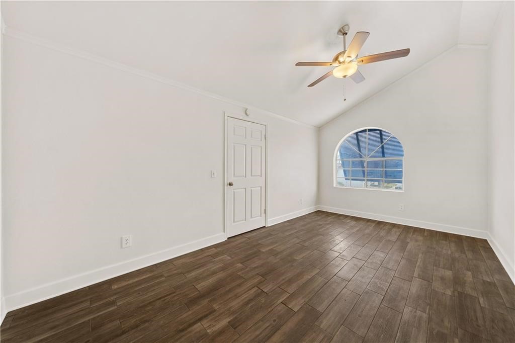 741 Snug Corpus Christi, TX 78402 - Photo 24 of 40 an empty room with wooden floor closet and windows