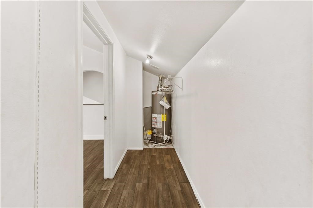 741 Snug Corpus Christi, TX 78402 - Photo 27 of 40 a view of a hallway with wooden floor and staircase