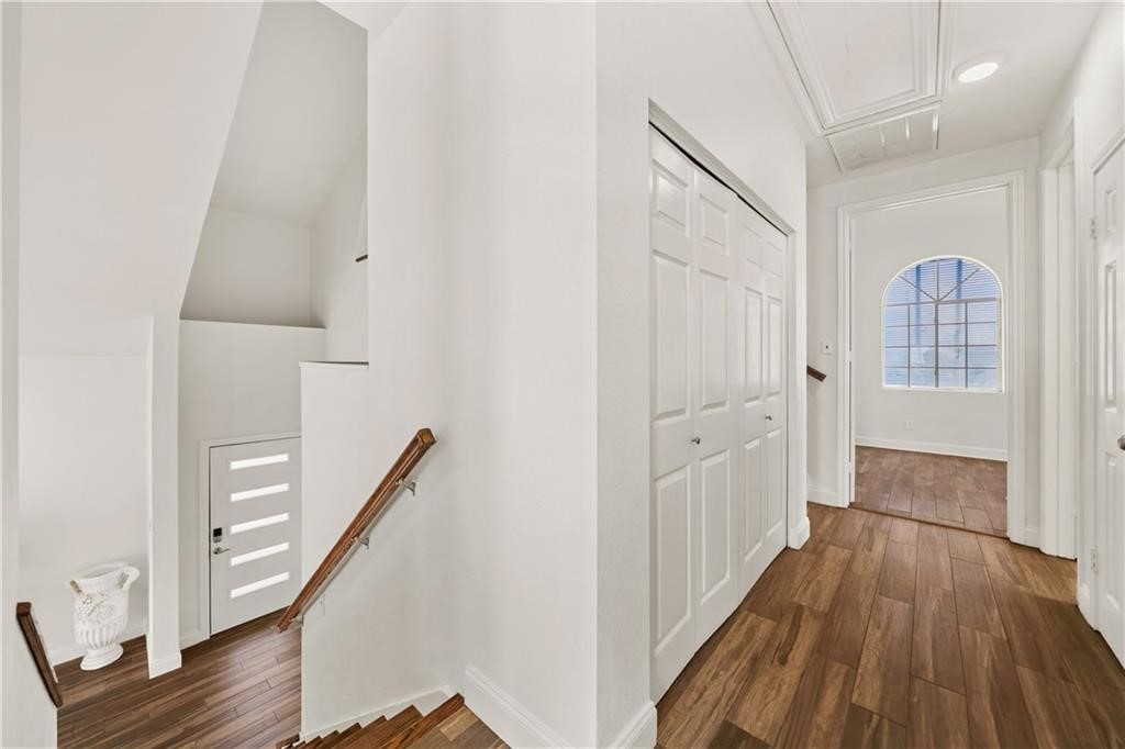 741 Snug Corpus Christi, TX 78402 - Photo 28 of 40 a view of a hallway with wooden floor and staircase
