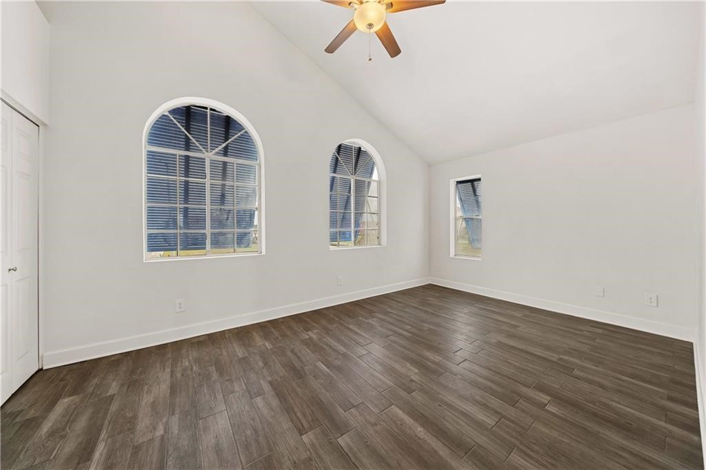741 Snug Corpus Christi, TX 78402 - Photo 6 of 40 a view of an empty room with a window and wooden floor