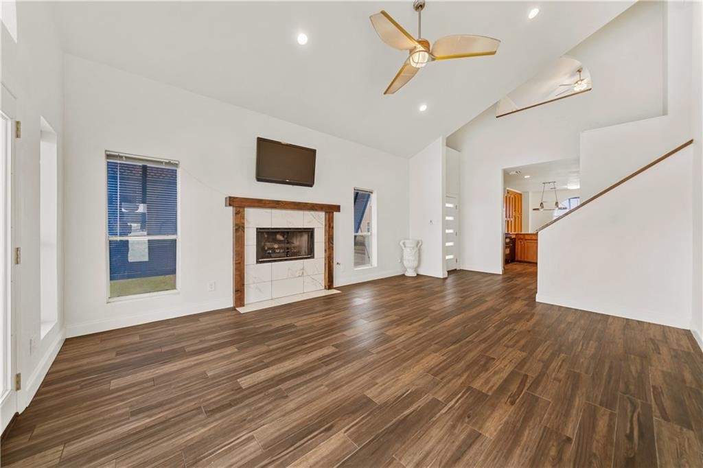 741 Snug Corpus Christi, TX 78402 - Photo 8 of 40 a view of empty room with wooden floor and fireplace