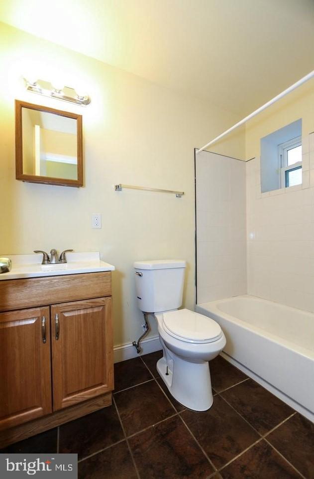 1708 West Diamond Street, Unit B Philadelphia, PA 19121 - Photo 18 of 20 a bathroom with a sink a toilet and shower