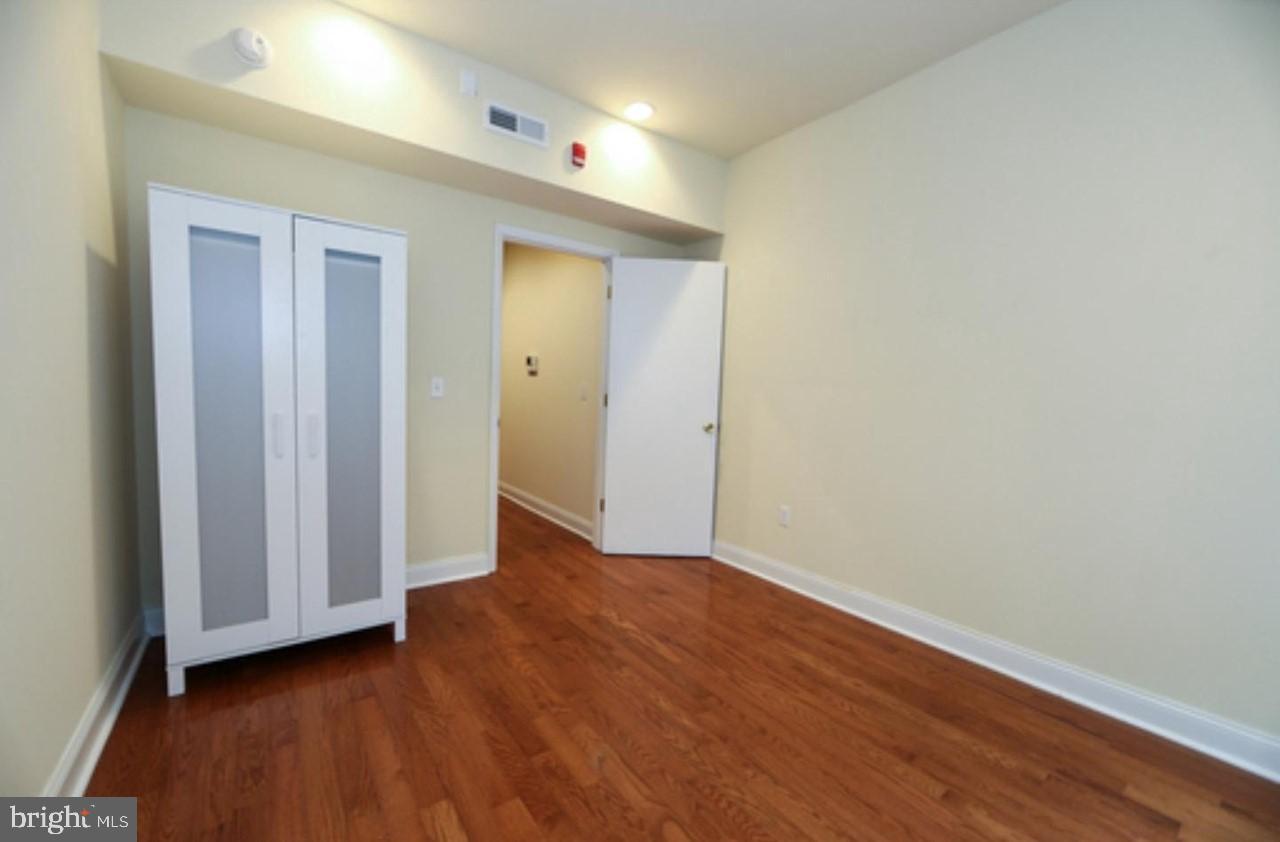 1708 West Diamond Street, Unit B Philadelphia, PA 19121 - Photo 10 of 20 a view of an empty room with wooden floor