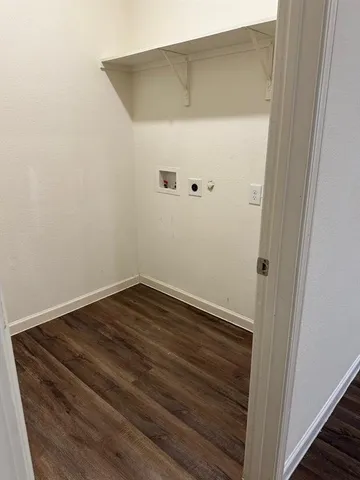 a view of a small space with wooden floor