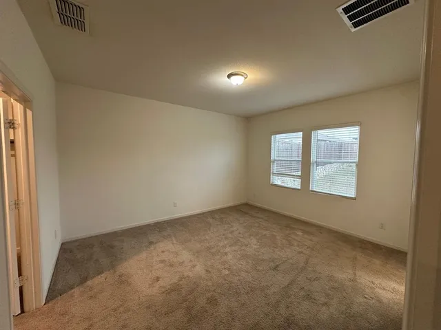a kitchen with a refrigerator and a sink
