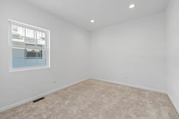 a bathroom with a toilet a sink a mirror and bathtub