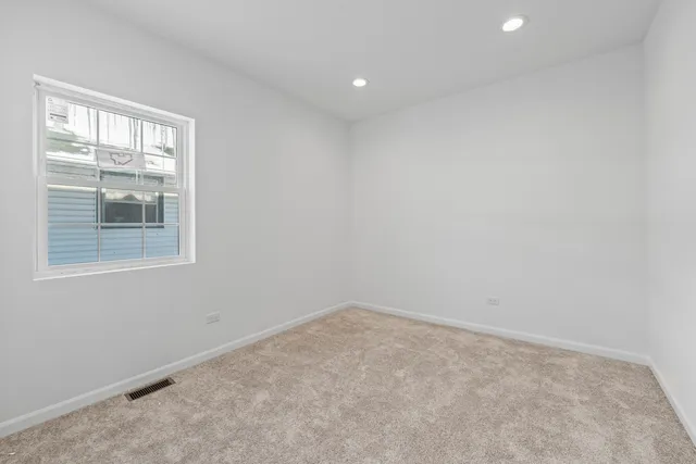 a bathroom with a toilet a sink a mirror and bathtub