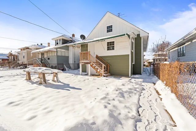 a front view of a building with sitting area