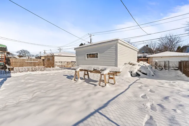 a view of a house with a snow on the road