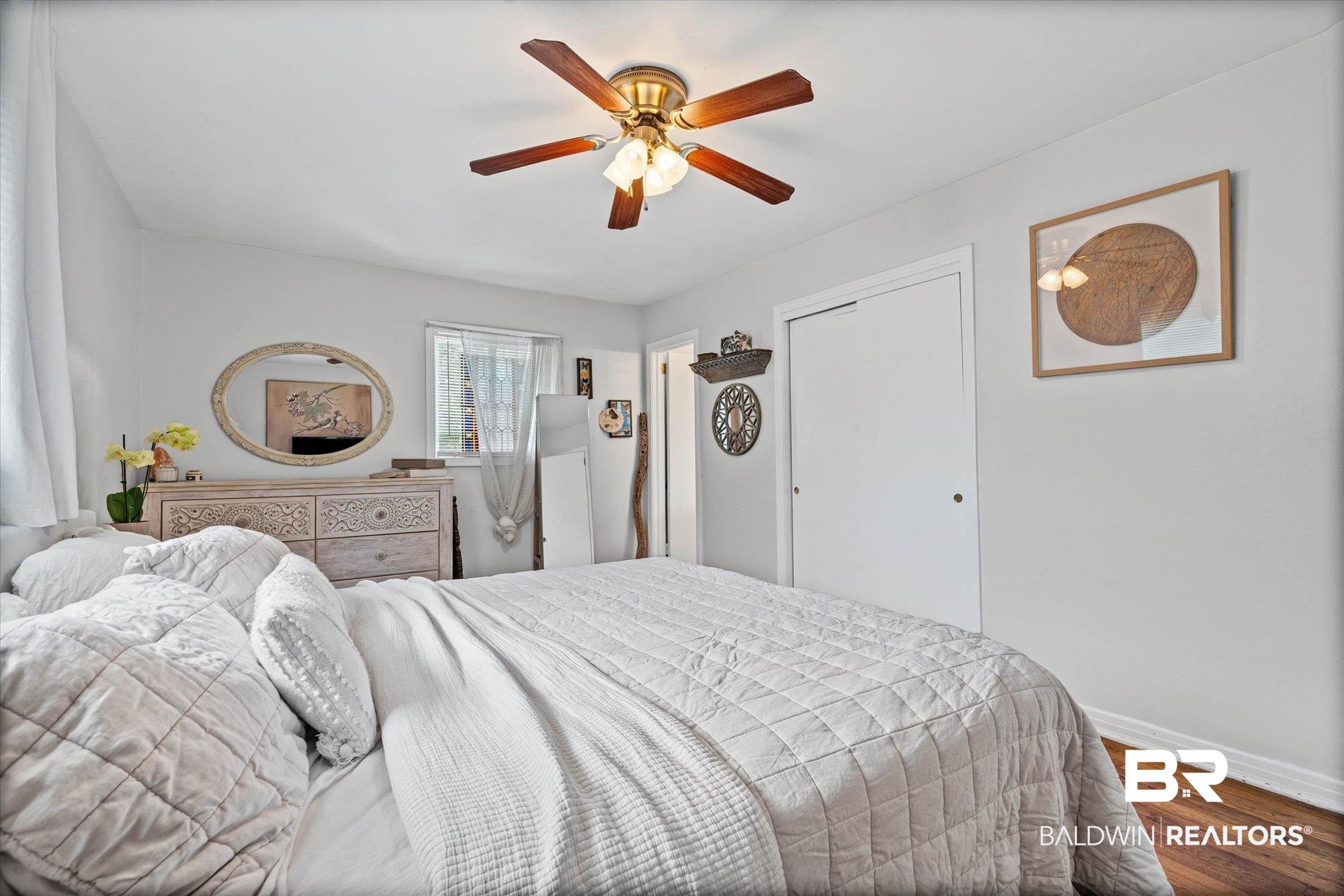 4213 Shan Drive East Mobile, AL 36693 - Photo 13 of 35 Interior space featuring a ceiling fan with integrated lighting, wood-finish flooring, and a window with natural light