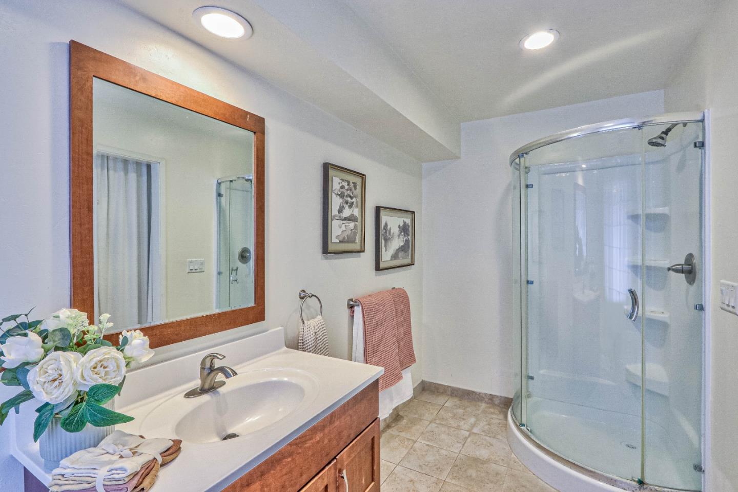 180 San Benancio Road Salinas, CA 93908 - Photo 20 of 27 a bathroom with a sink mirror and shower