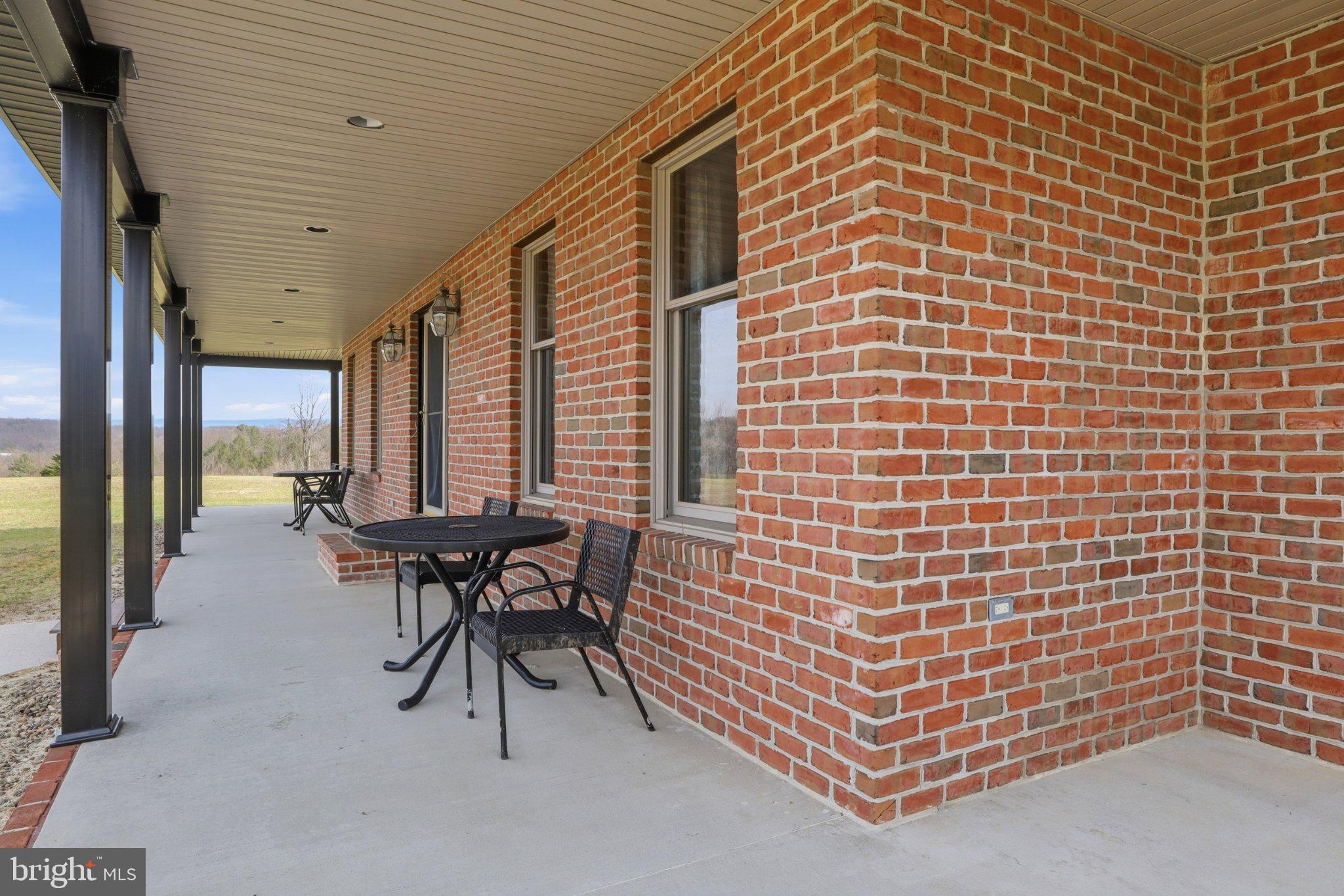 57 Mahanoy Valley Road Duncannon, PA 17020 - Photo 5 of 70 Charming brick porch with scenic views.