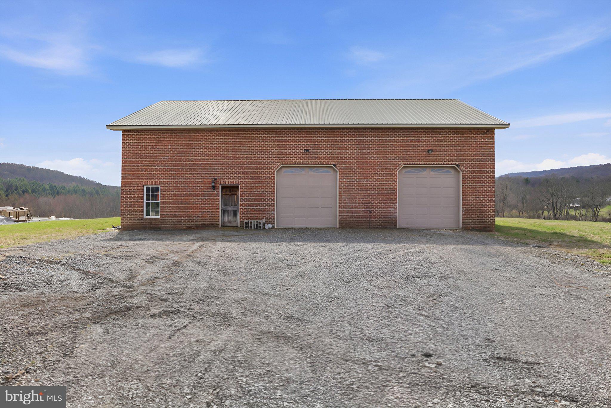 57 Mahanoy Valley Road Duncannon, PA 17020 - Photo 56 of 70 Spacious brick garage with scenic views.