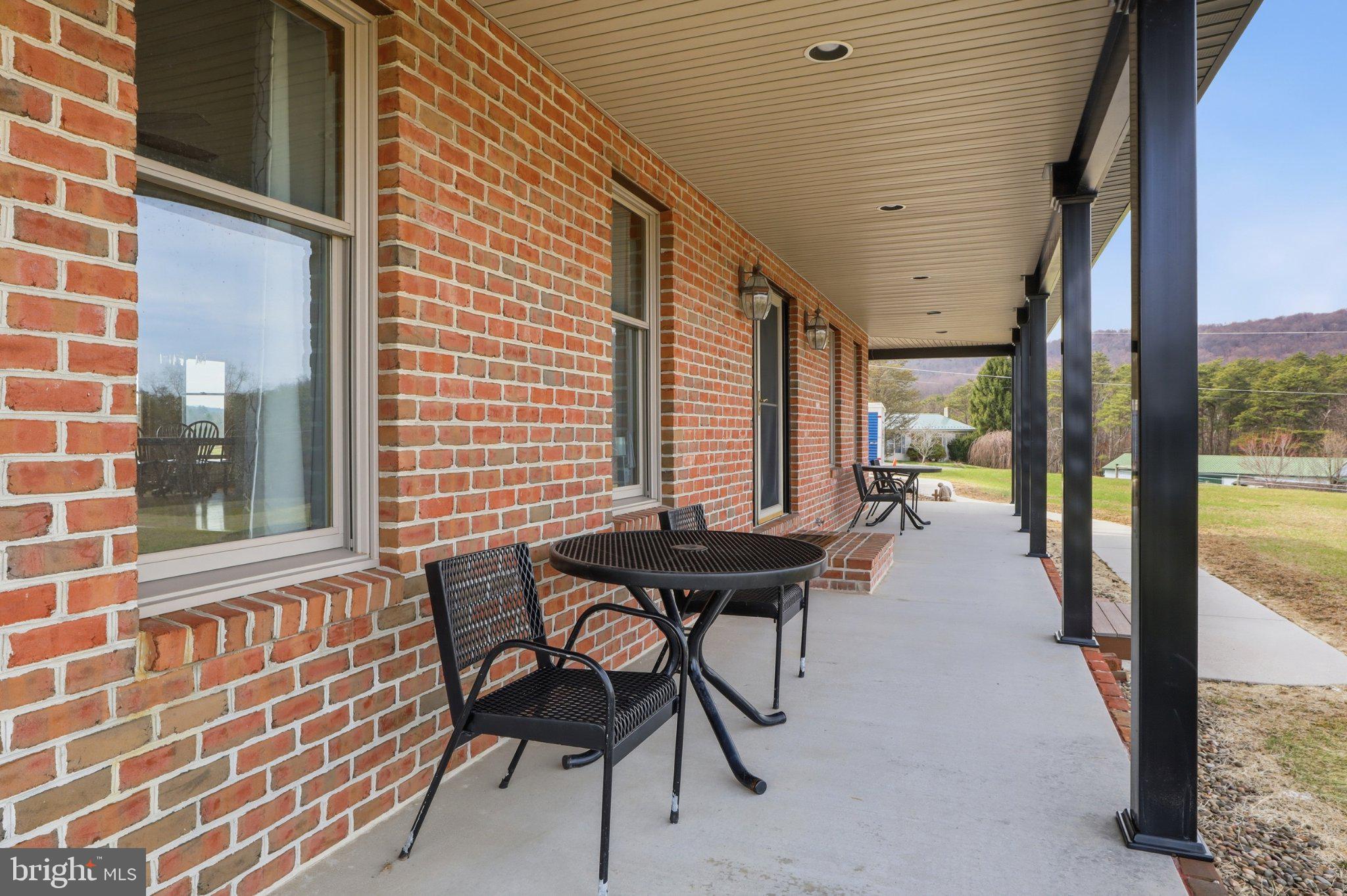 57 Mahanoy Valley Road Duncannon, PA 17020 - Photo 6 of 70 Charming brick porch with scenic views.