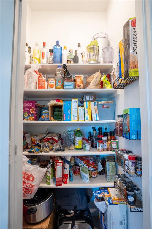 753 Rutherford Drive Crowley, TX 76036 - Photo 12 of 26 Built-in pantry storage featuring multiple adjustable shelves, integrated wire shelving, and bright interior lighting
