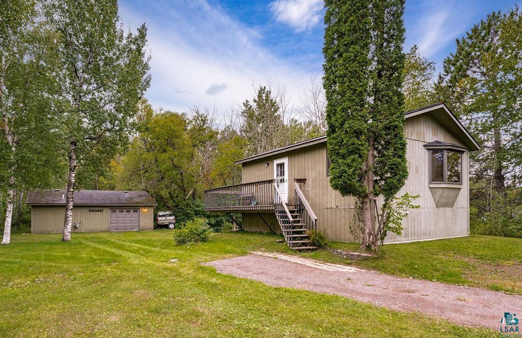 4738 Morris Thomas Road Hermantown, MN 55811 - Photo 1 of 19 Wood-sided property with a bay window, elevated deck, and exterior stairs