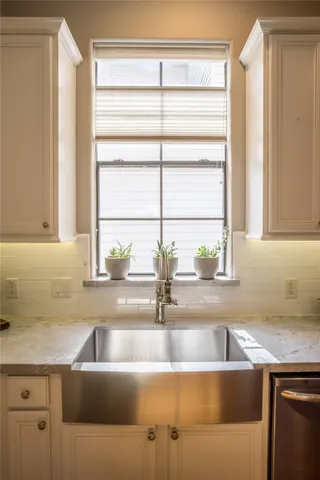a dining room with furniture water view and wooden floor