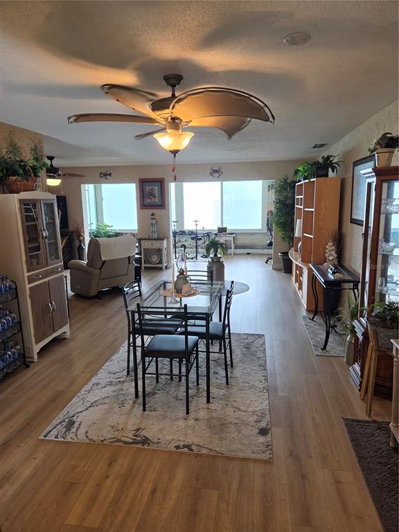 7 Dunoon Place, Unit 309 Dunedin, FL 34698 - Photo 13 of 25 a view of a dining room with furniture window and wooden floor