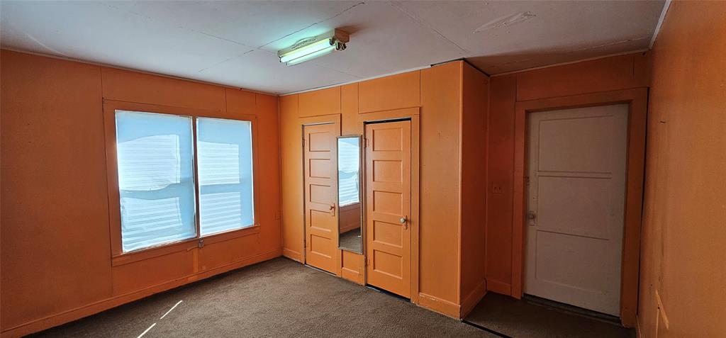 501 South Main Street Eden, TX 76837 - Photo 12 of 20 an empty room with windows and closet