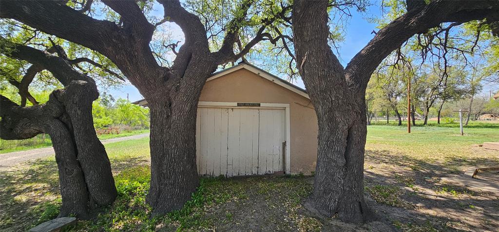 501 South Main Street Eden, TX 76837 - Photo 18 of 20 a view of a house with a backyard