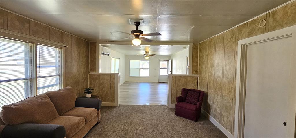 501 South Main Street Eden, TX 76837 - Photo 5 of 20 a living room with furniture and a fireplace