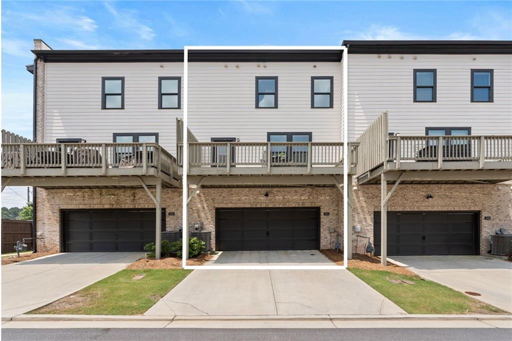 3334 Swallowtail Terrace Duluth, GA 30096 - Photo 12 of 27 a front view of a house with yard