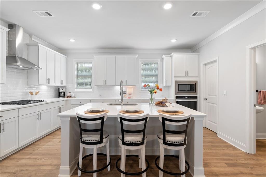 3334 Swallowtail Terrace Duluth, GA 30096 - Photo 20 of 30 a kitchen with a table and chairs in it