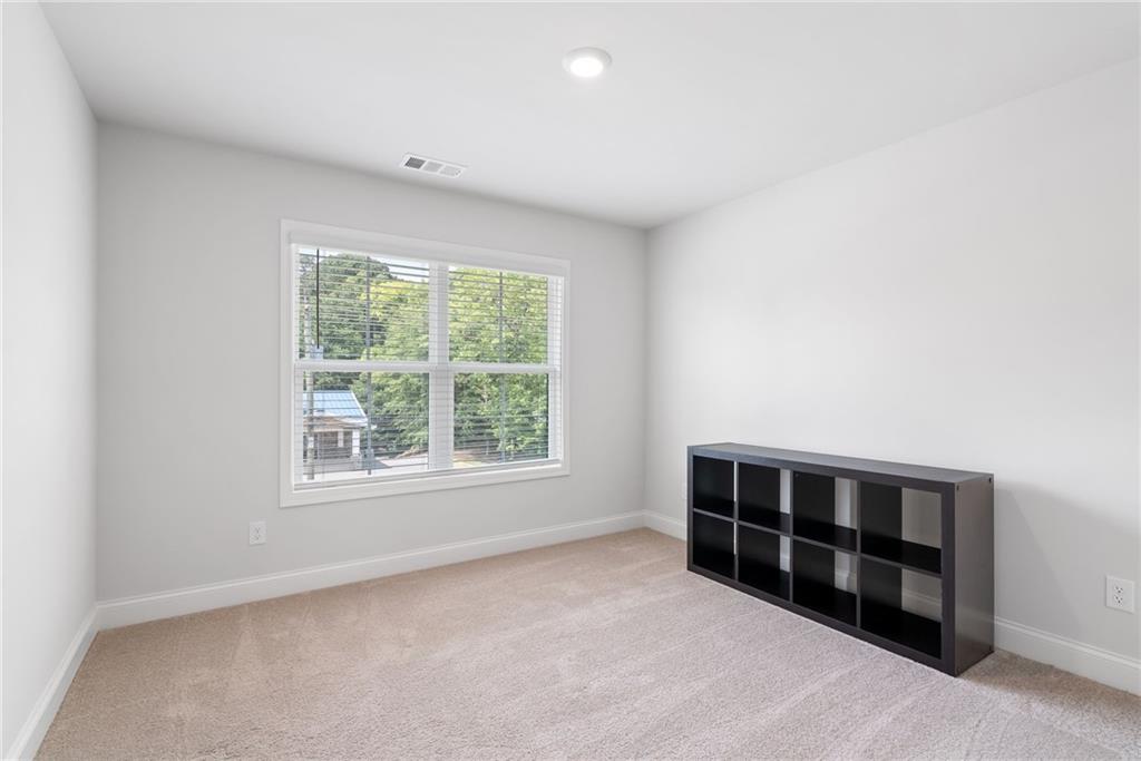3334 Swallowtail Terrace Duluth, GA 30096 - Photo 21 of 27 an empty room with furniture