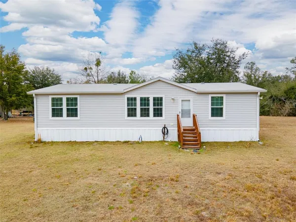 a view of a house with a patio