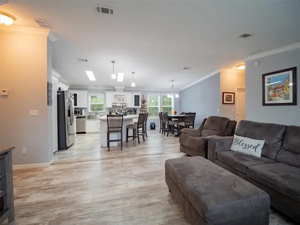 a kitchen with stainless steel appliances granite countertop a stove and cabinets