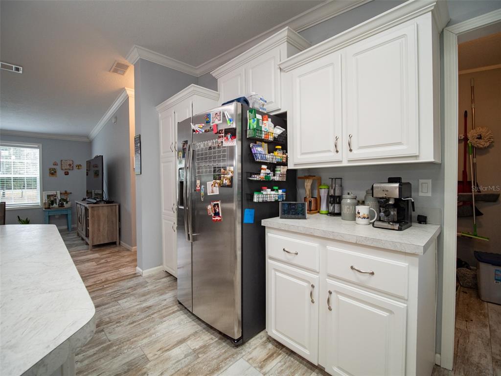 5431 163rd Path Live Oak, FL 32060 - Photo 19 of 49 a kitchen with stainless steel appliances granite countertop a refrigerator sink and cabinets