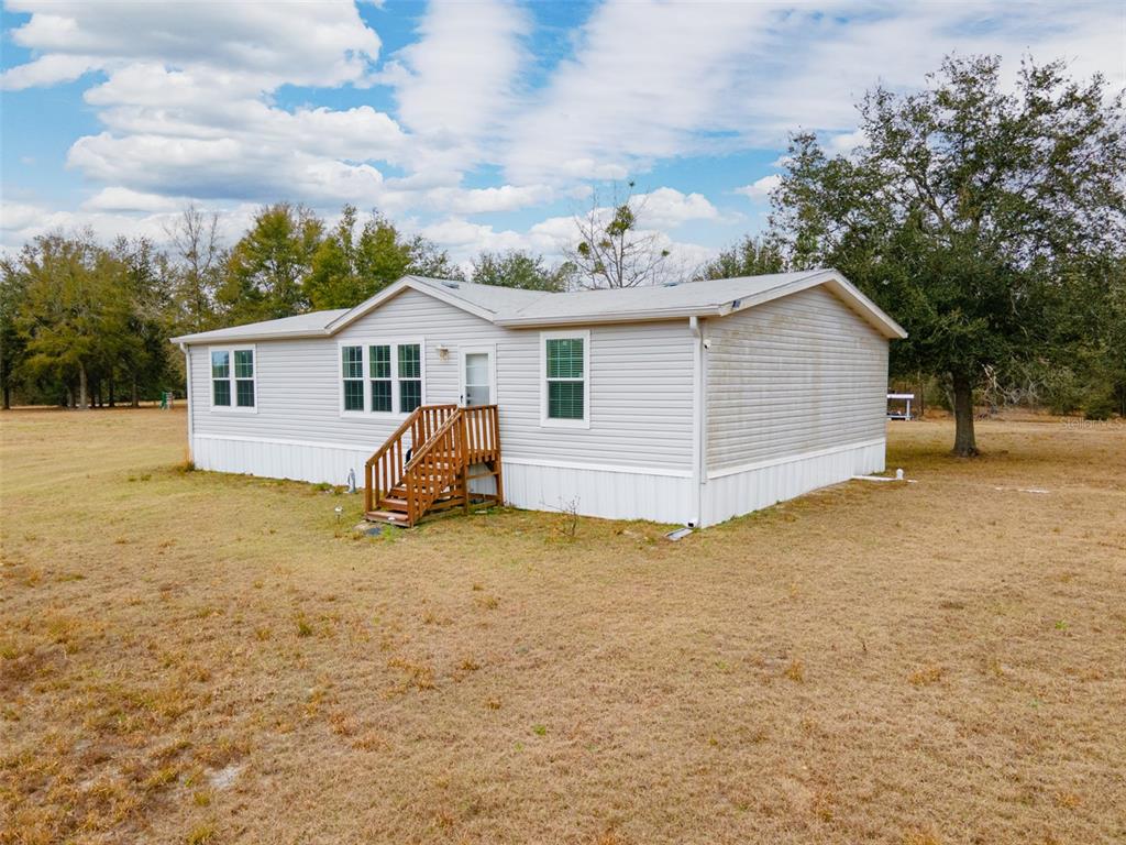 5431 163rd Path Live Oak, FL 32060 - Photo 2 of 49 a view of a house with a yard