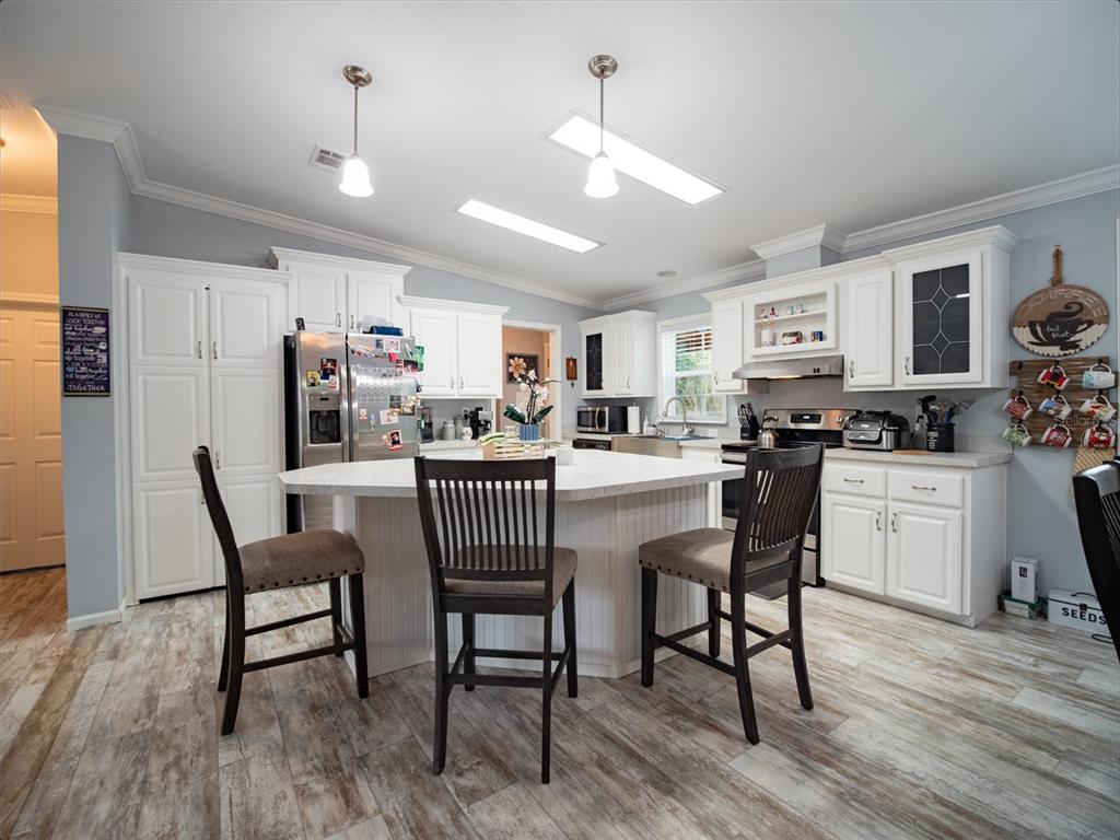 5431 163rd Path Live Oak, FL 32060 - Photo 21 of 49 a dining room with furniture and wooden floor