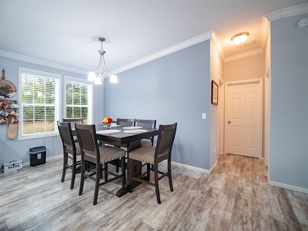 5431 163rd Path Live Oak, FL 32060 - Photo 23 of 49 a view of a dining room with furniture window and wooden floor