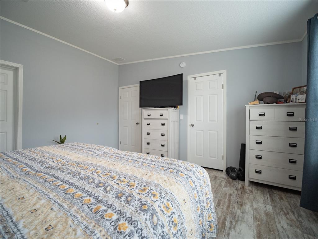 5431 163rd Path Live Oak, FL 32060 - Photo 28 of 49 a bedroom with a bed and a television