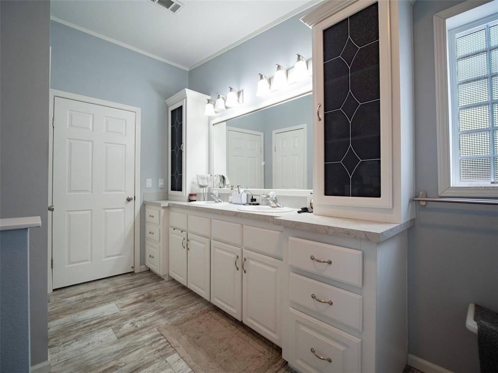 5431 163rd Path Live Oak, FL 32060 - Photo 31 of 49 a bathroom with a sink and a mirror
