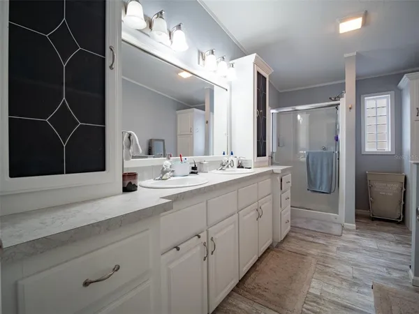 a bathroom with a granite countertop toilet and a sink