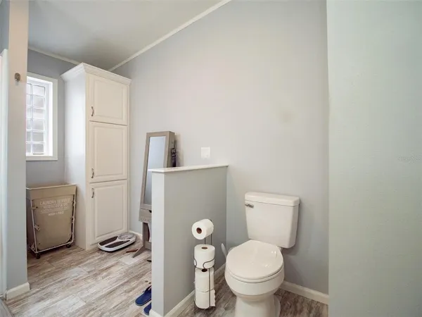 a view of walk in closet with clothes