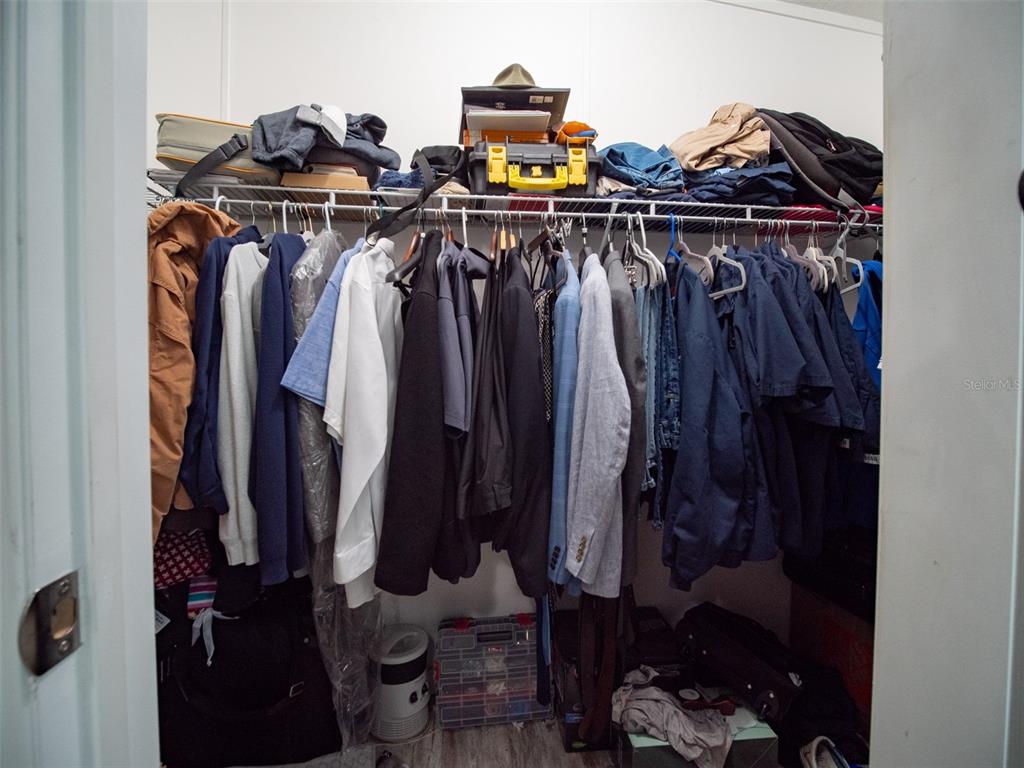 5431 163rd Path Live Oak, FL 32060 - Photo 34 of 49 a view of walk in closet with clothes