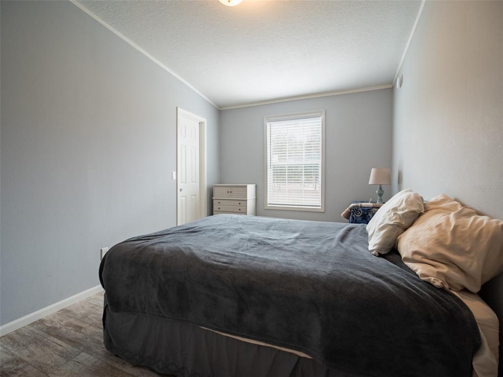 5431 163rd Path Live Oak, FL 32060 - Photo 36 of 49 a bedroom with a bed and window