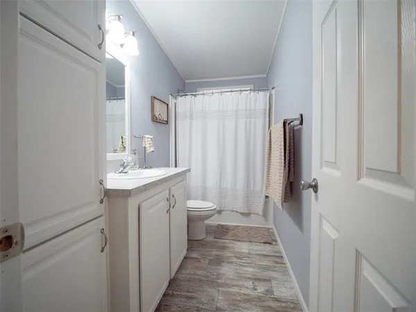 a bathroom with a bathtub and shower
