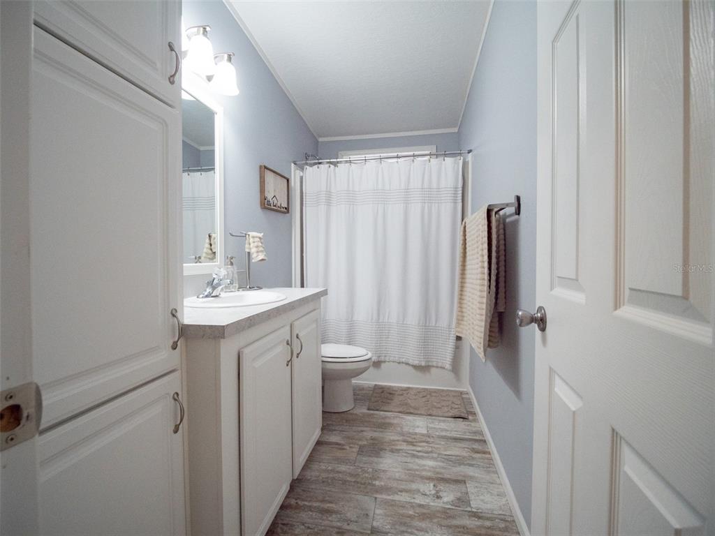 5431 163rd Path Live Oak, FL 32060 - Photo 37 of 49 a bathroom with a sink a toilet and shower