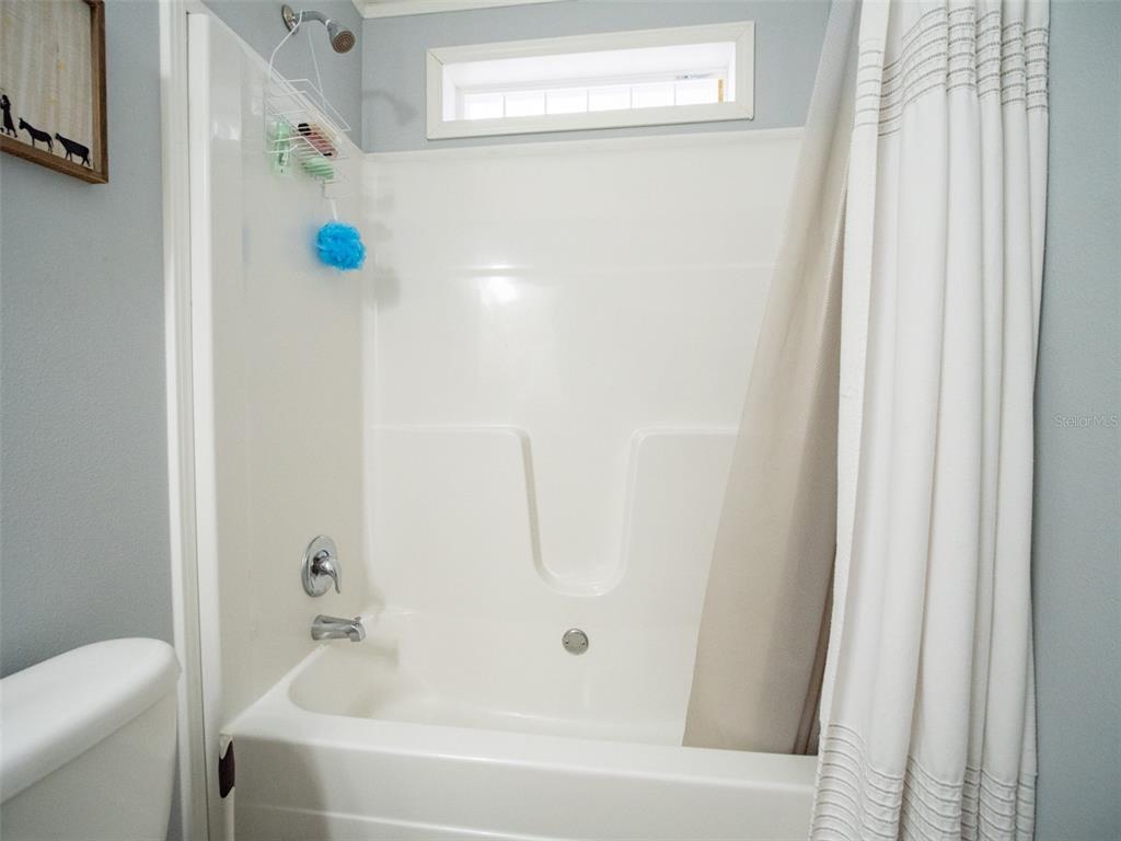 5431 163rd Path Live Oak, FL 32060 - Photo 38 of 49 a bathroom with a bathtub and shower