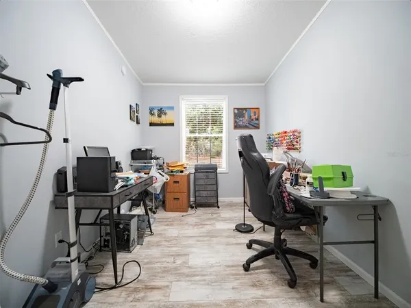 a workspace with furniture and wooden floor