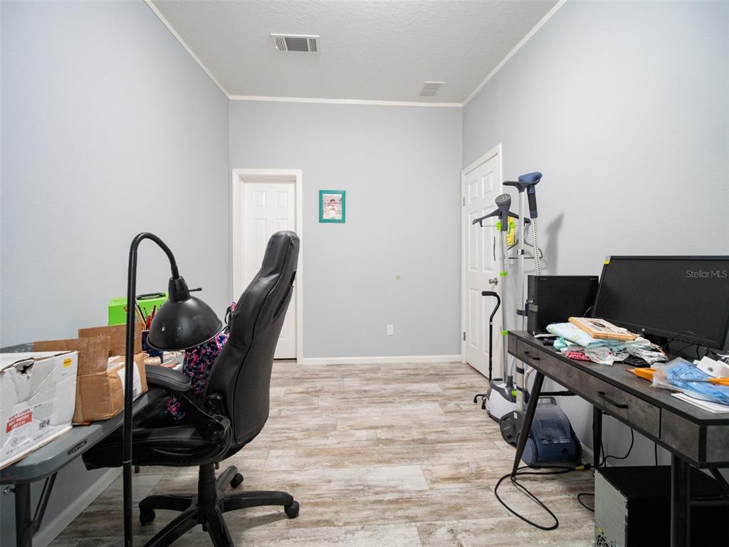 5431 163rd Path Live Oak, FL 32060 - Photo 41 of 49 a workspace with furniture and wooden floor