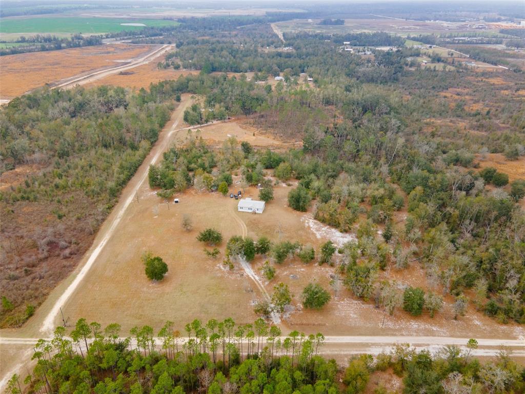 5431 163rd Path Live Oak, FL 32060 - Photo 8 of 49 an aerial view of ocean with yard