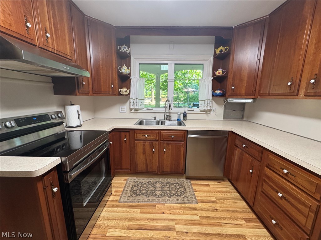 296 Fairfield Road Painesville, OH 44077 - Photo 18 of 48 Another view of the U-shaped kitchen with plenty of cabinetry