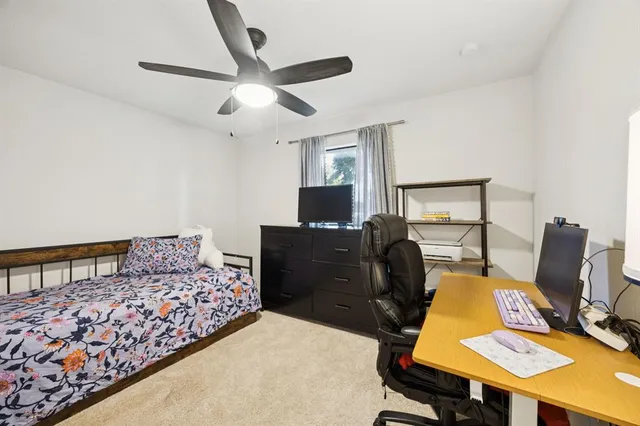 a bedroom with a bed and furniture