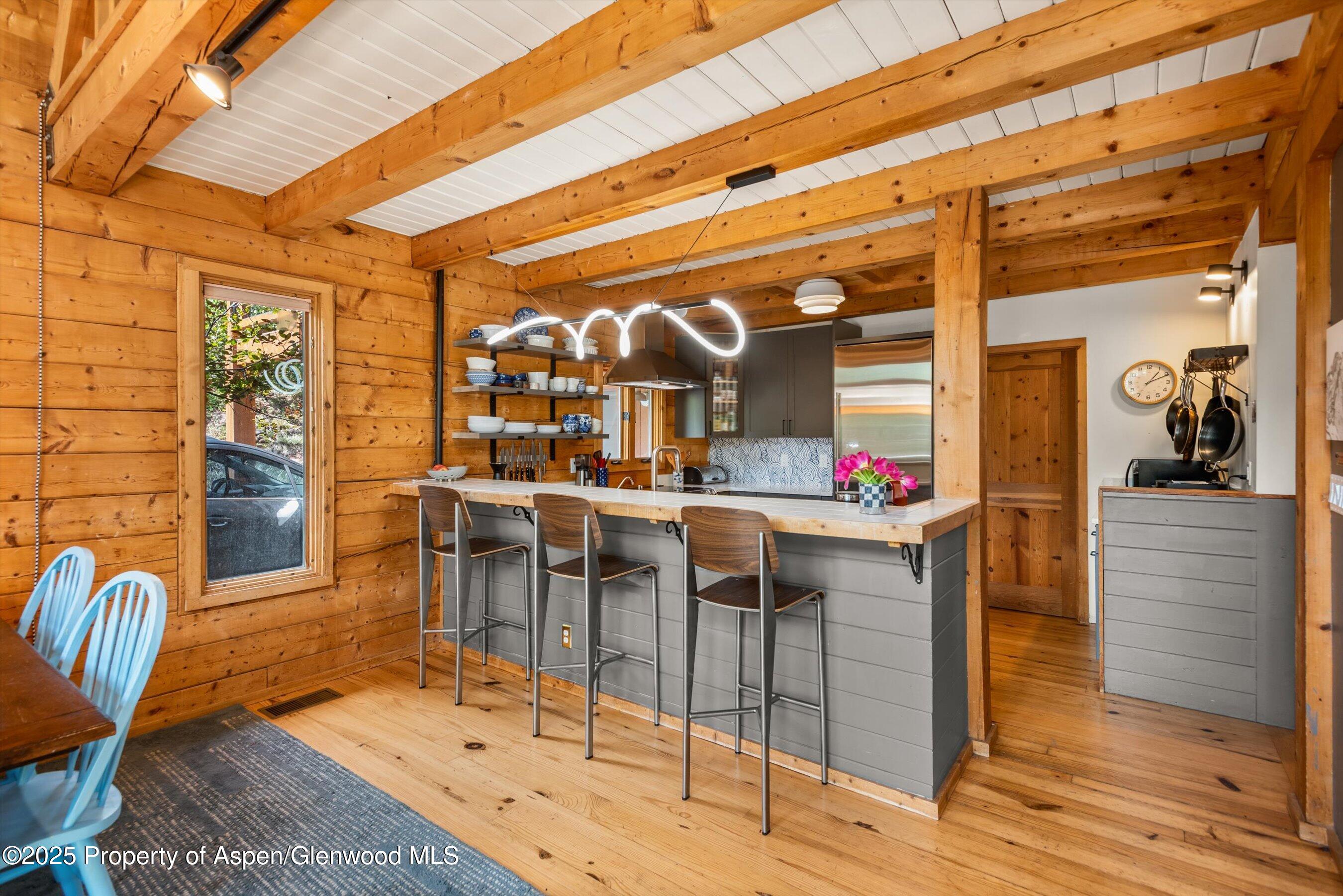166 Ute Trail Carbondale, CO 81623 - Photo 22 of 38 a view of a dining room with furniture and wooden floor